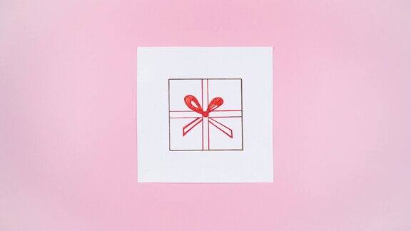 用红丝带绑在牛皮纸上的礼品盒的图画出现在白纸上