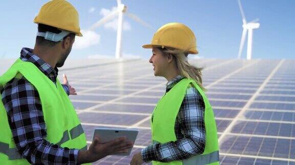 人们工作的替代能源与风力涡轮机和太阳能电池板-创新和绿色能源