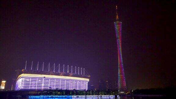 在现代城市广州夜晚灯光装饰着塔和体育场