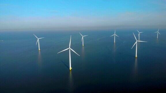 荷兰海上风力涡轮机产生绿色能源无人机在风电场公园观看