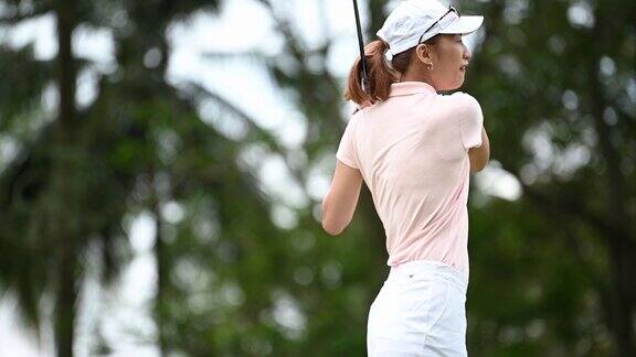 慢动作亚洲中国女高尔夫球手打高尔夫开球