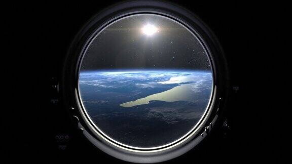 地球通过飞船的舷窗窗外的阳光国际空间站绕地球运行向右移动现实的气氛国际空间站4k