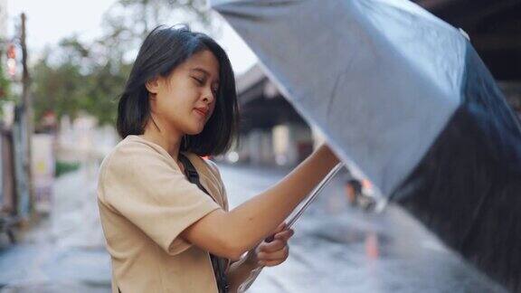 亚洲女人打伞的慢镜头