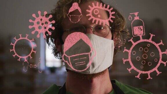 新冠肺炎图标的动画在陶艺工作室的男子戴着口罩