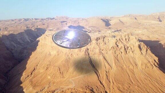 外星飞碟飞碟在沙漠中的古城上空-空中