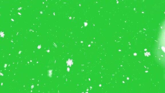 慢慢飘落的雪花在绿色的背景上