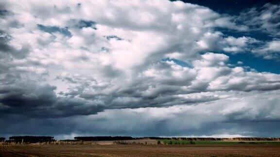 TimeLapseTime-LapseTime-LapseOfRuralFieldSpringMeadowLandscapeUnderScenicDramaticSkyBeforeAndDuringRa