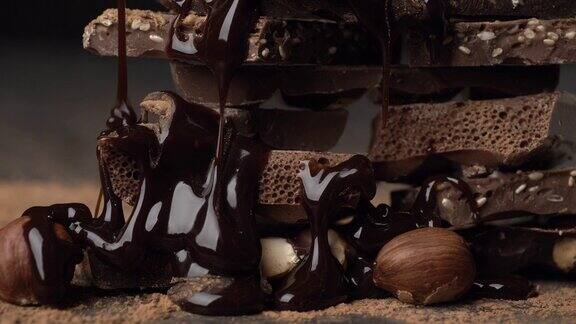 各种巧克力和坚果上面覆盖着巧克力滑动镜头特写