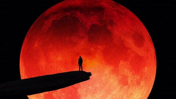 一个人的剪影站在悬崖边看着夜空中一个巨大的血月