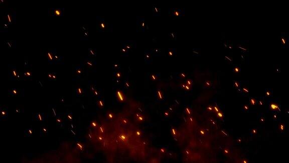 燃烧着的红色炽热的火花飞离了夜空中的大火