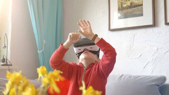 男孩探索虚拟现实和玩4k慢动作游戏的视频