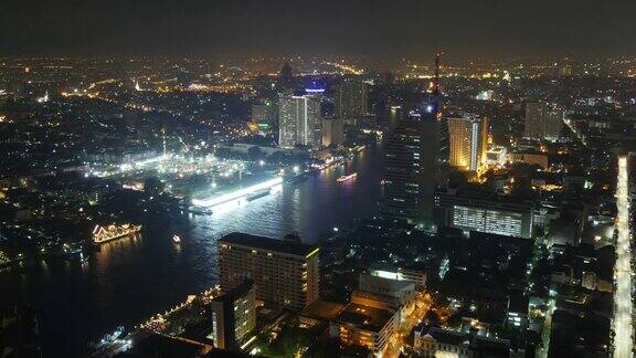 泰国曼谷夜间灯光酒店屋顶河上交通船全景4k时间推移