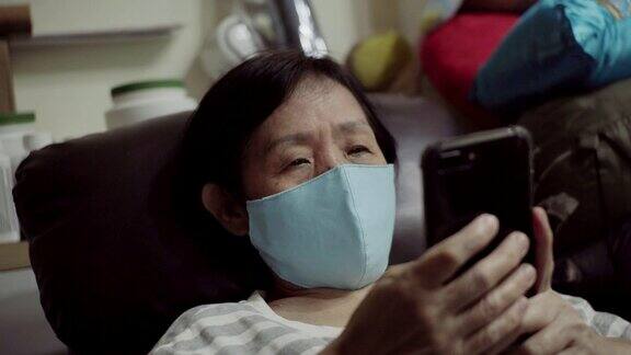 亚洲老年妇女戴防护口罩