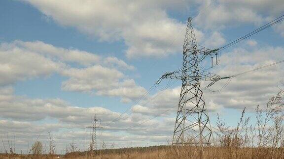 电力高压塔对抗美丽的天空在野外输电塔电塔电线和电线映衬着蓝天和白云能源效率