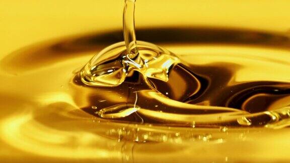 橄榄油倾泻而下溅起水花用高速摄影机以每秒1000帧的速度拍摄
