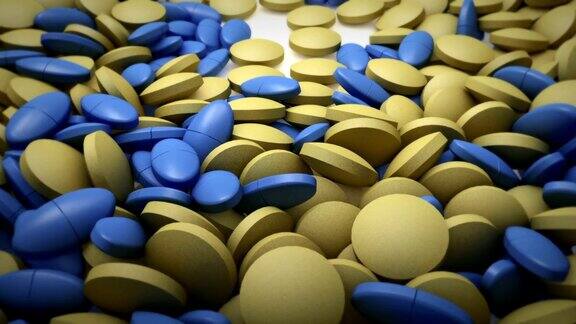 蓝色和黄色的药片落在白色的背景