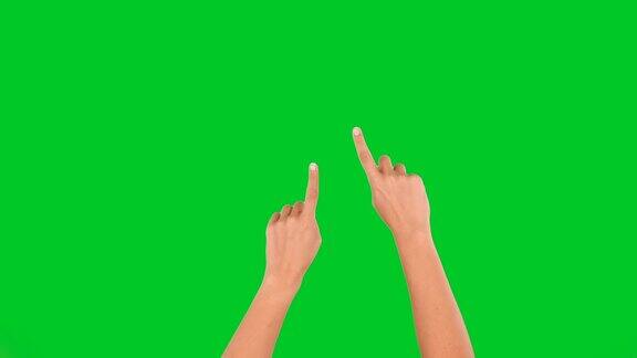 4K女人手触屏放大和缩小在绿色屏幕上