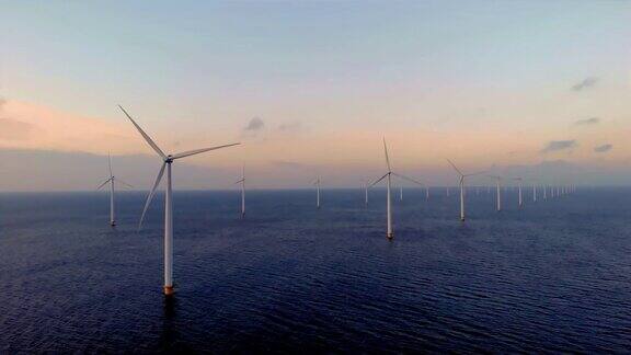 海上风车公园日落时分海上风车公园的风力涡轮机鸟瞰图