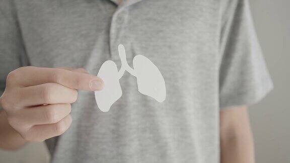 手握肺世界结核病日世界无烟日肺癌covid-delta病毒COPD生态空气污染器官捐赠概念