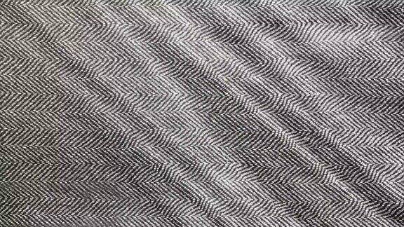 人字织物布近距离的背景黑白花呢图案织造纺织材料