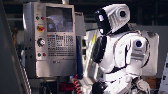 工作机器人在工厂机器上按按钮