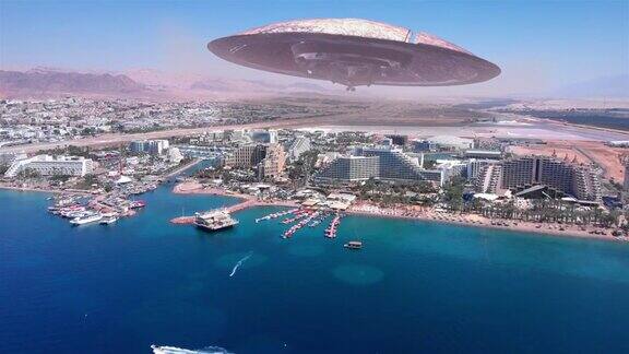 外星人飞碟飞碟在大型度假城市沙漠附近的海航拍