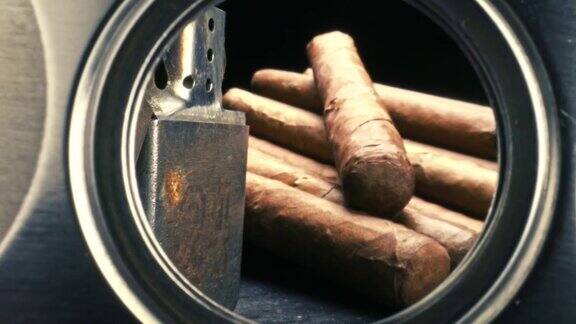雪茄在雪茄盒和打火机通过雪茄切割机查看