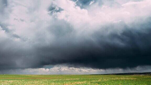 TimeLapseTime-LapseTime-LapseOfRuralFieldSpringMeadowLandscapeUnderScenicDramaticSkyBeforeAndDuringRa