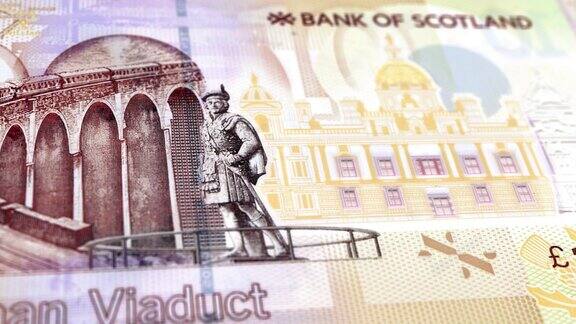 苏格兰10英镑钞票10英镑苏格兰英镑的特写和宏观视图跟踪和多利镜头10英镑钞票观察和储备面苏格兰英镑货币货币背景苏格兰