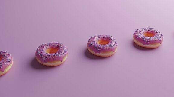 粉色的甜甜圈排成一排像在传送带上一样移动