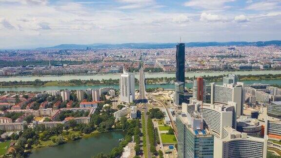 阳光明媚的一天维也纳城市现代市中心河边航拍4k时间跨度的奥地利