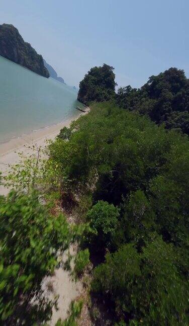垂直视频4k亚洲天堂岛沙滩长尾游船观光飞天