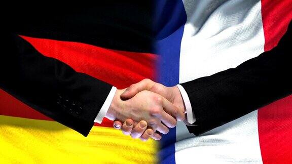德国与法国握手标志着国际友好关系的背景