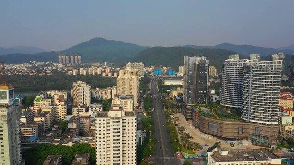 阳光明媚的日子三亚市城市景观交通街道空中全景4k海南岛中国