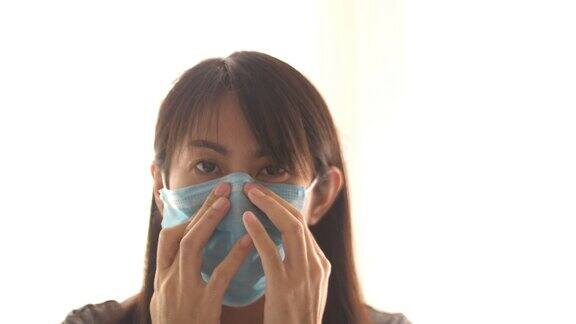 亚洲妇女戴外科口罩以保护病毒
