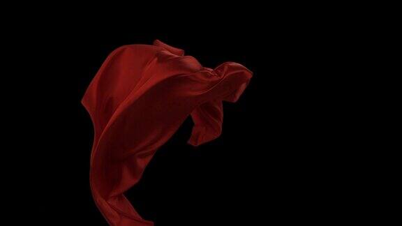 红色织物在黑色背景上流动慢镜头