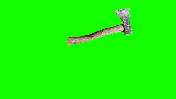 在绿色屏幕上使用带有木柄的老式斧头