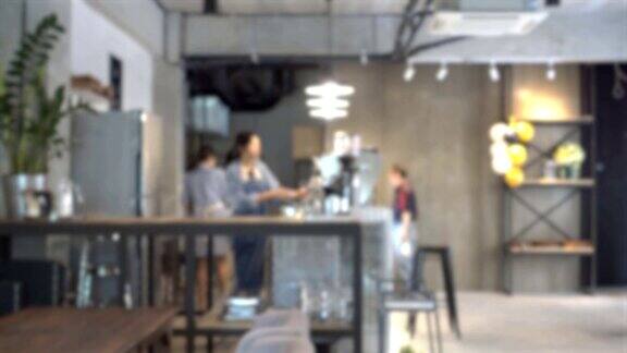 抽象模糊的咖啡馆或咖啡店内部与顾客和咖啡师在柜台工作