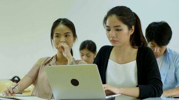 亚洲大学生在学习时看起来不开心感到压力