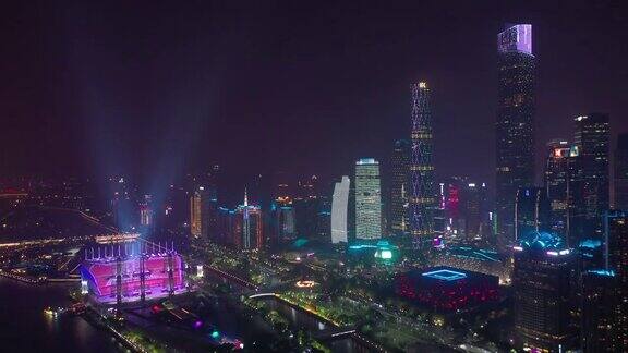 夜景照亮了广州市著名的现代市中心滨江体育场4k中国航拍全景