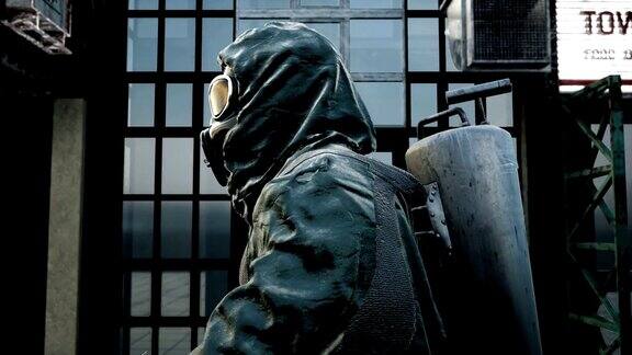 一名身穿军装、戴着防毒面具的流浪男子正穿过这座被毁的城市核战争后世界末日