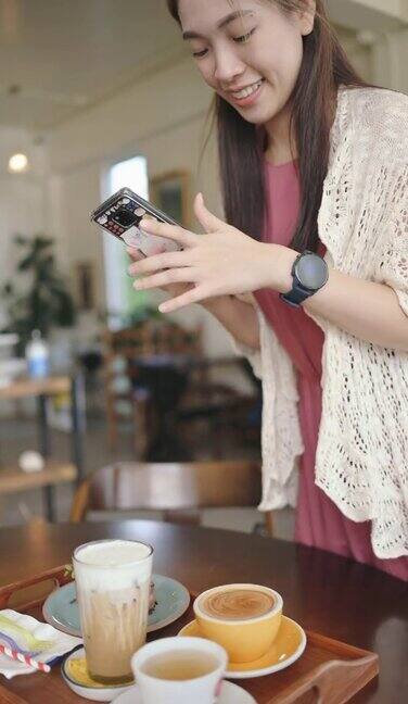 z一代亚洲女性正在用手机拍她的咖啡和甜点