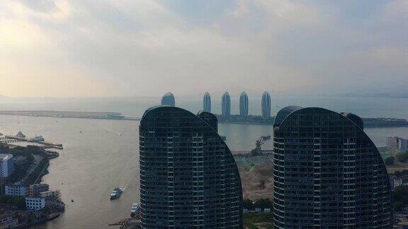 日落时分海南岛三亚湾著名酒店航拍全景4k中国