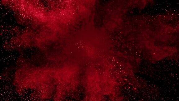 红色粉末在黑色背景上以超慢镜头爆炸