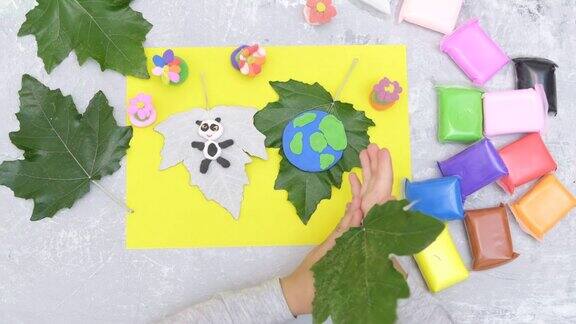 孩子为地球日雕刻橡皮泥星球保护环境拯救我们的星球生态学艺术学习与教育