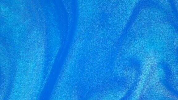 4k墨水在水里蓝墨水在水中产生反应创造抽象的背景