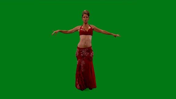 舞者肚皮舞肚皮舞者跳舞绿色的屏幕性感的红裙子