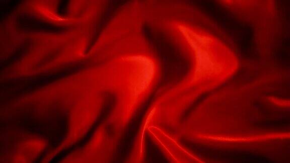 红色波浪光滑的丝绸面料在风中荡漾纹理背景