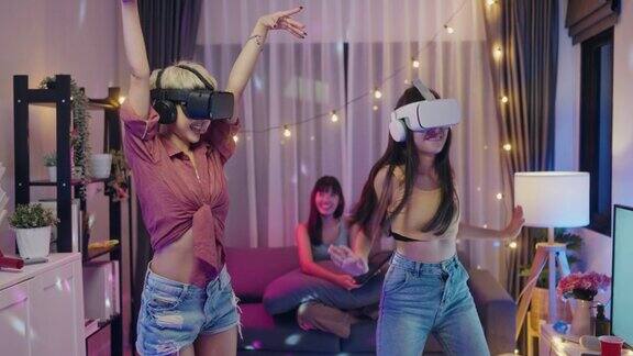 快乐的女性朋友有一个有趣的VR舞蹈游戏派对