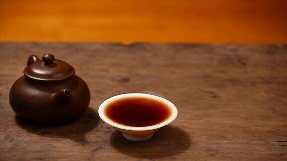 茶壶黑热茶杯木桌高清画面
